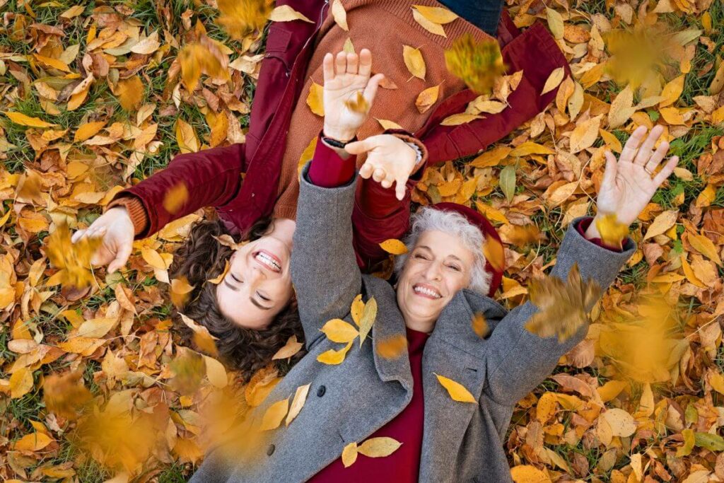 seniors in fall leaves