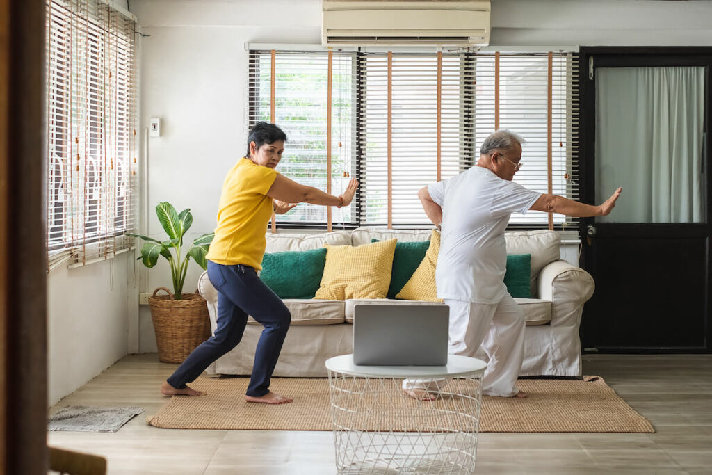 Older couple doing tai chi at home - Bartlett Reserve - Senior Living Durham, NC Older couple doing tai chi at home