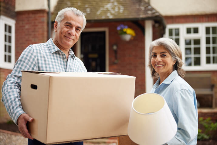 How To Downsize for Retirement Senior couple working on downsizing for retirement